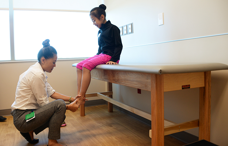 Physician examining patient at Texas Scottish Rite Hospital for Children 