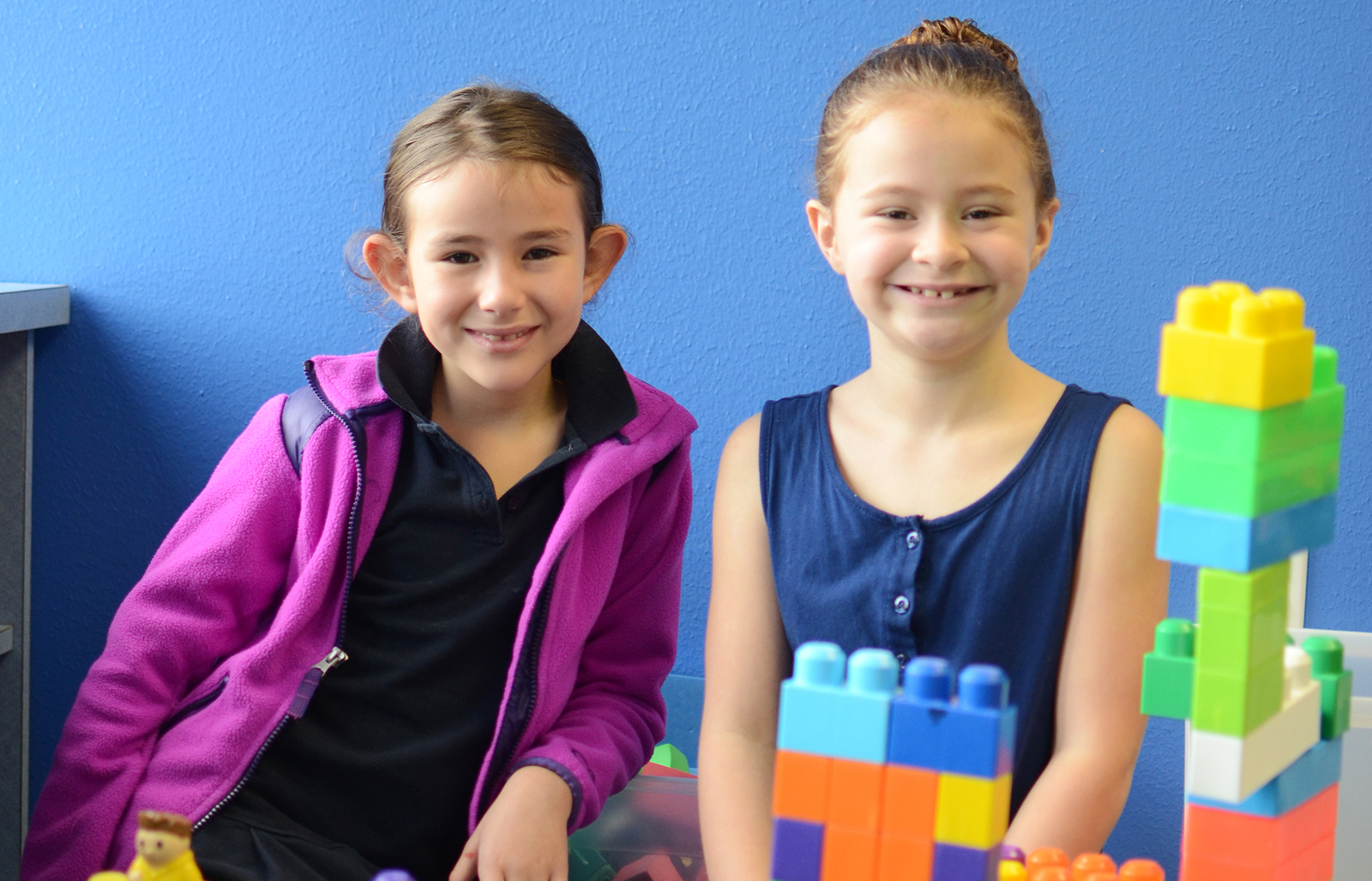 Texas Scottish Rite Hospital for Children patients smiling while playing with blocks